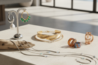 Curated collection of 2025 trending fine jewelry featuring diamond huggie hoops and stacking rings