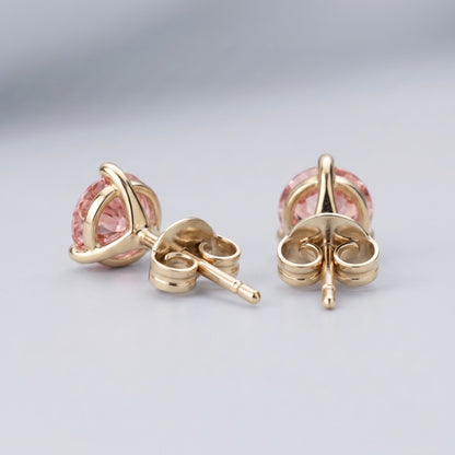 Pink diamond stud earrings in 14K yellow gold