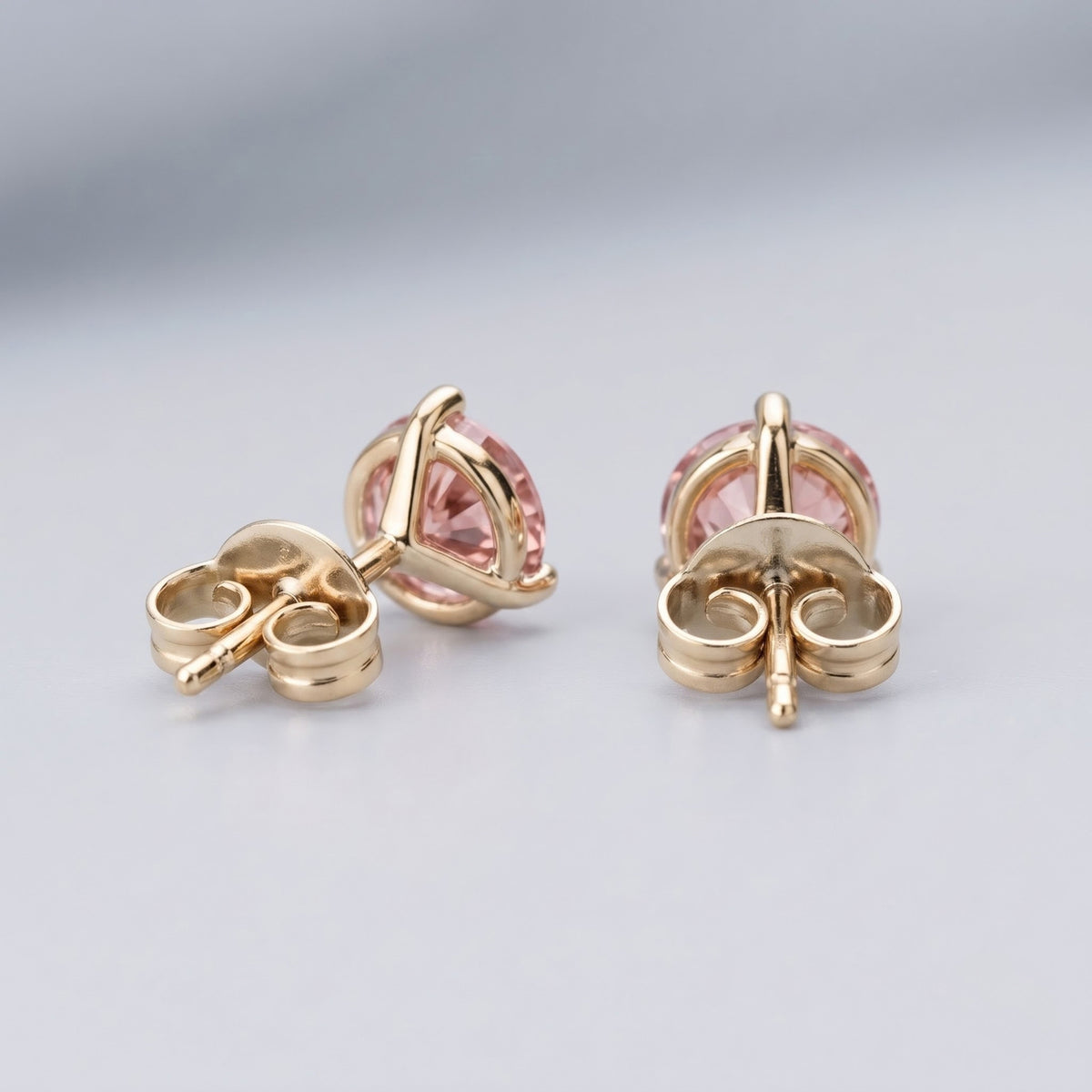 Pink diamond stud earrings in 14K yellow gold