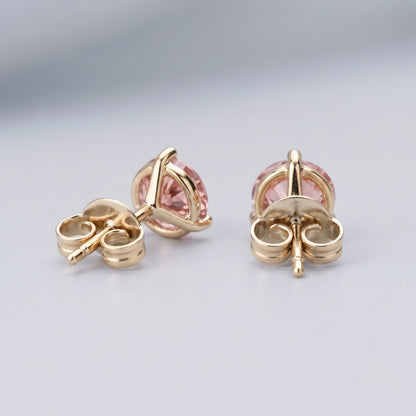 Pink diamond stud earrings in 14K yellow gold