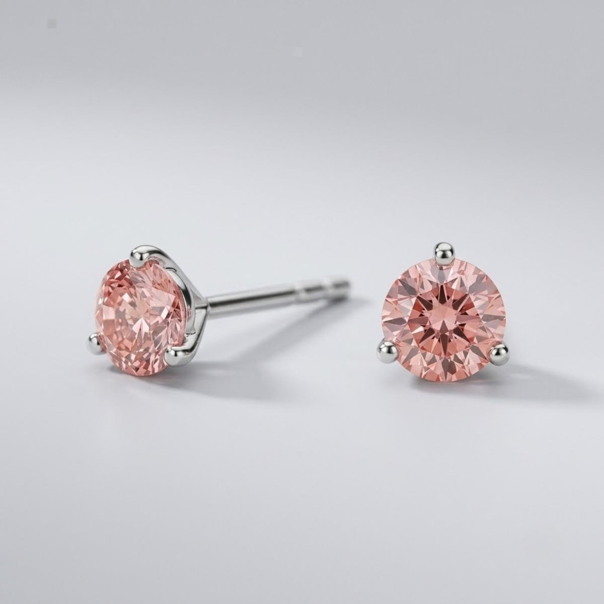 Pink diamond stud earrings in 14K white gold
