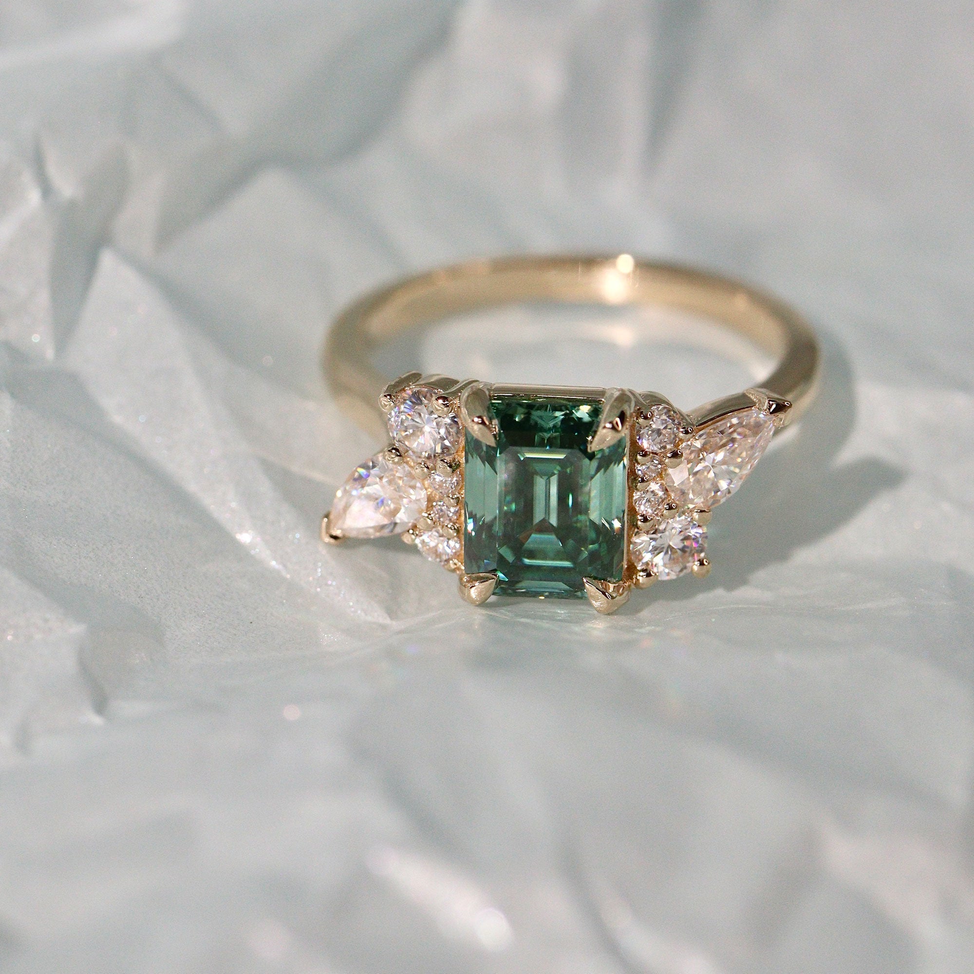 Meghan Emerald Cut Asymmetric Cluster Engagement Ring