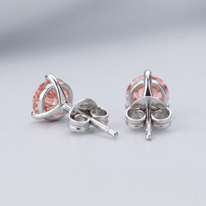 Pink diamond stud earrings in 14K white gold back setting.
