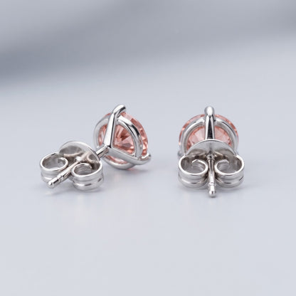 Pink diamond stud earrings in 14K white gold back setting.