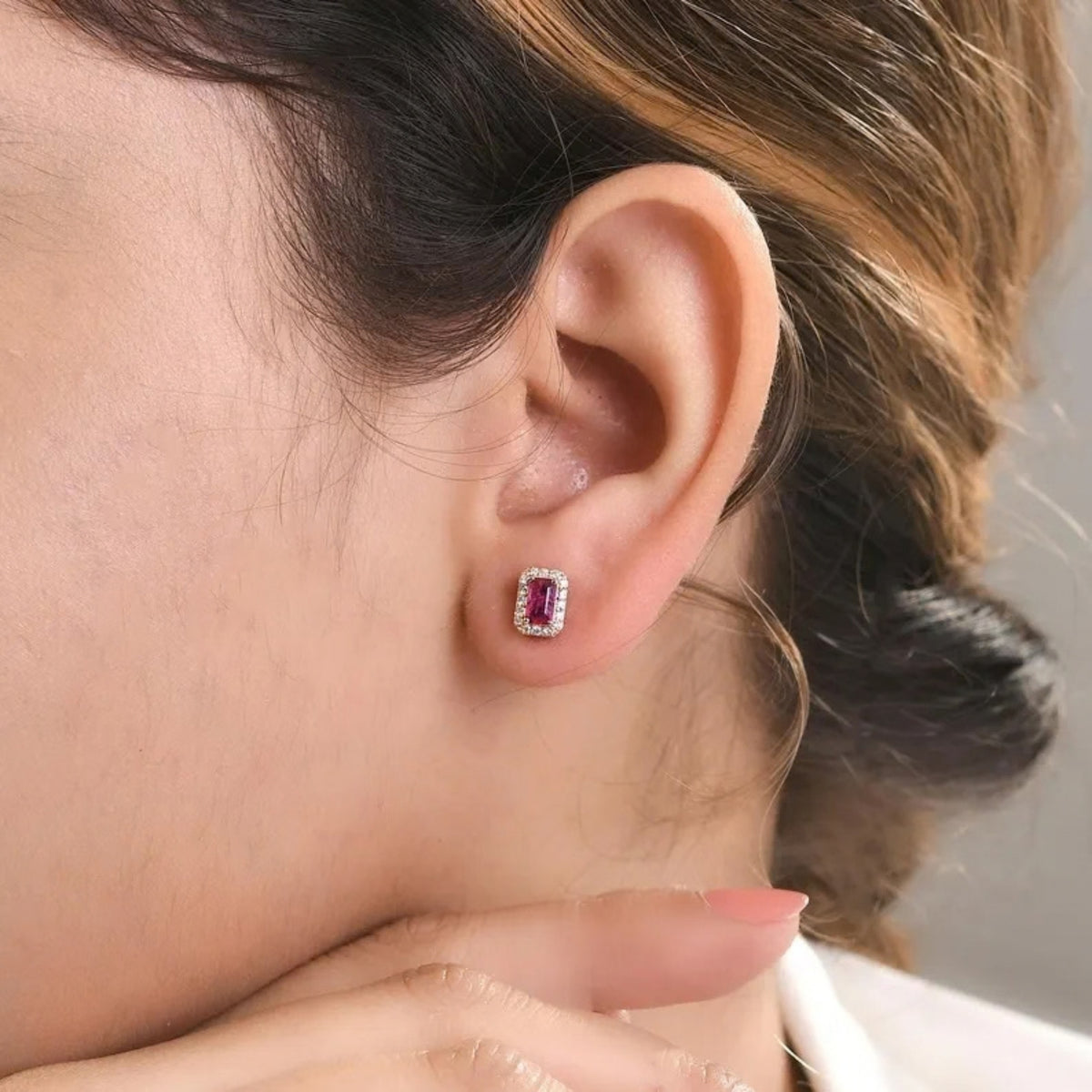 Pink sapphire and diamond earrings styled for a special occasion