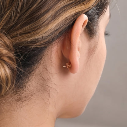 Pink sapphire and diamond earrings styled for a special occasion