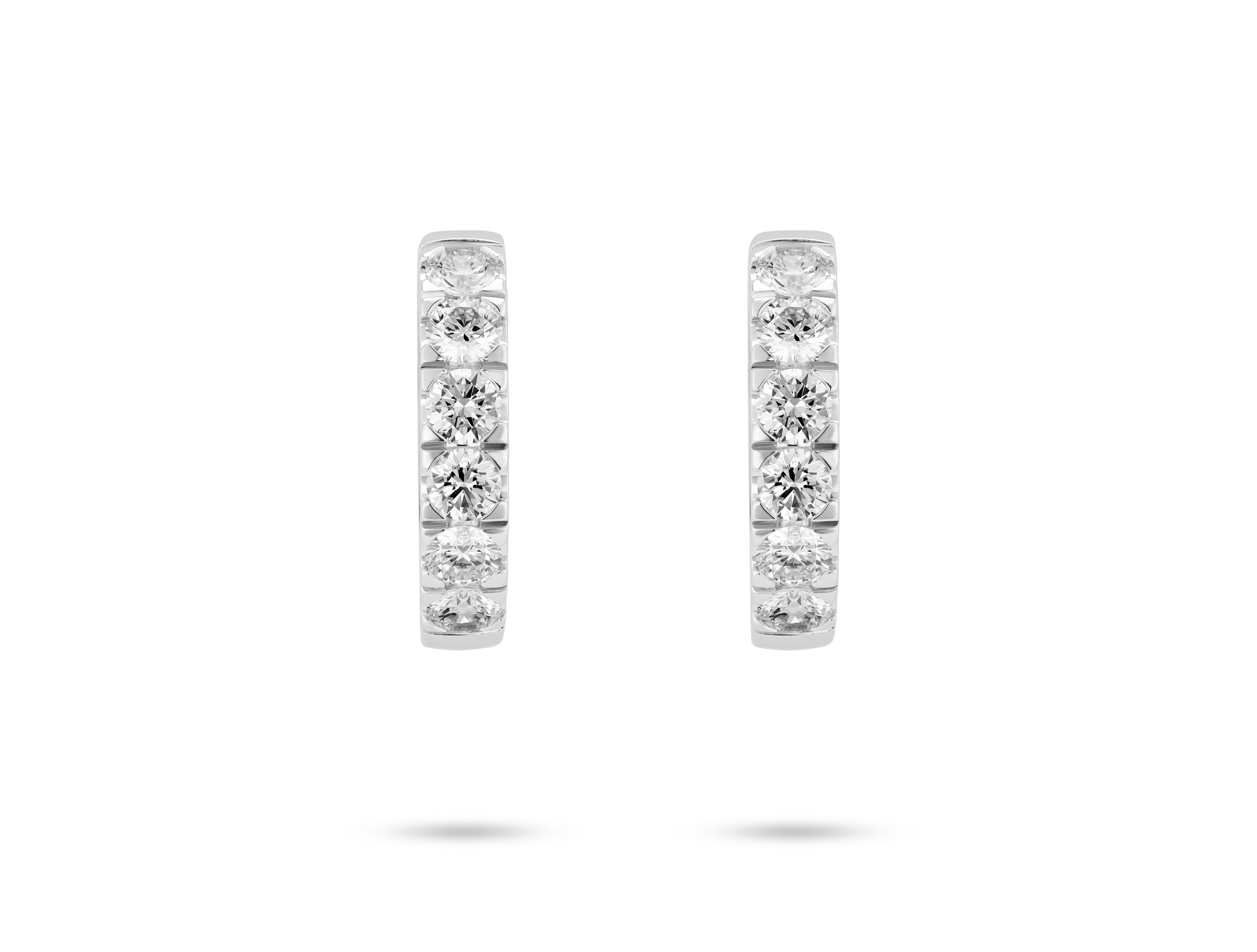 Front view of 1.2 carat total weight pavé huggie hoops in 14k white gold