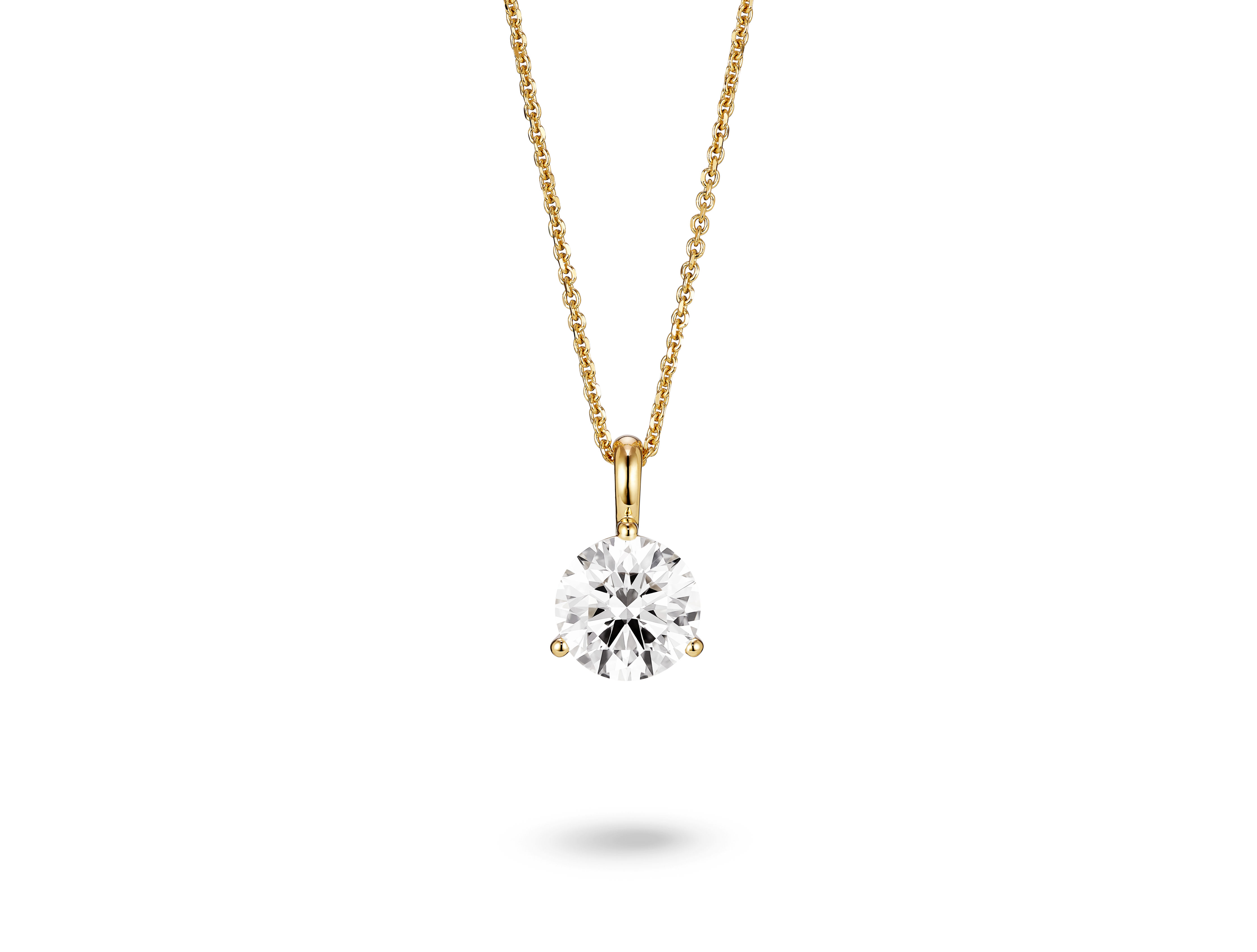 Front view of a lab-grown 1.5 carat round brilliant solitaire on a bale pendant in yellow gold